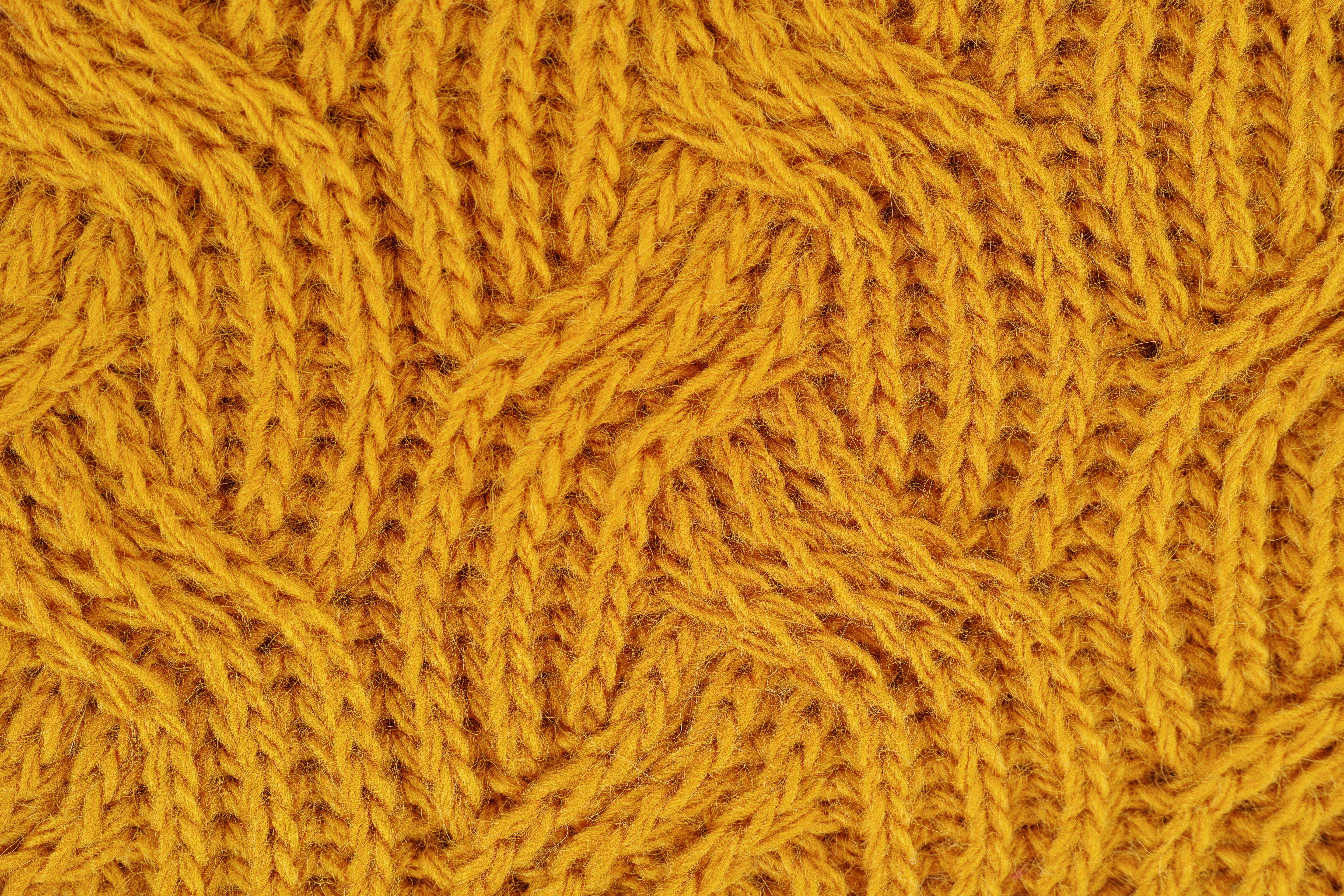 close up of yellow knitted pattern
